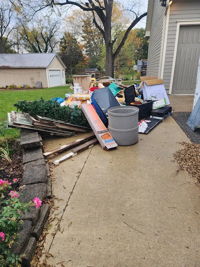 Dumpster being loaded with debris for Commercial Dumpster Rental in Yadkinville